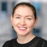 Woman smiling at camera.